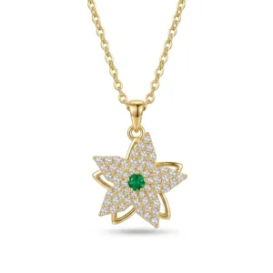Close-up detail of the gold-plated star flower pendant necklace with shimmering cubic zirconia.