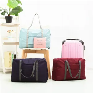 Large capacity waterproof foldable travel duffel bag with trolley sleeve and storage pouch.
