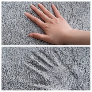Soft grey plush floor mat, highly absorbent anti-slip bathroom rug for home daily use.