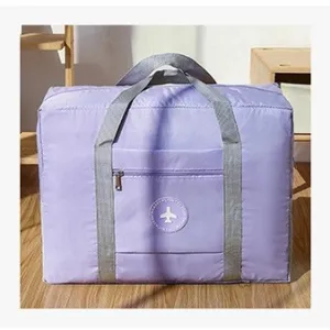 Foldable travel duffel bag in light purple with trolley sleeve and front zipper pocket.