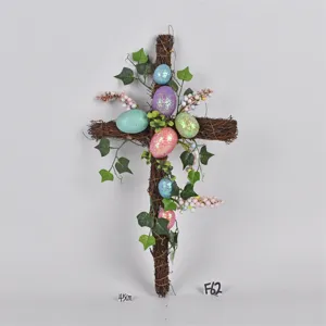 Easter twig cross decoration detail featuring glittery eggs and ivy leaves for spring holiday decor.
