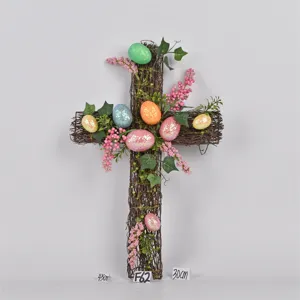 Easter vine cross wreath with colorful glitter eggs and berries for spring holiday home decor.