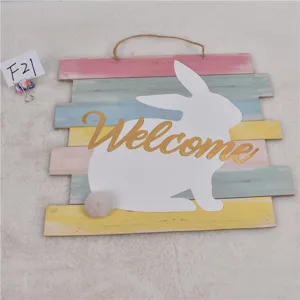 Easter wooden bunny wall sign detail showing colorful pastel planks and cute fuzzy tail.