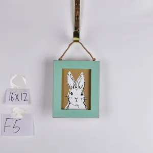 Wooden Easter rabbit picture frame wall hanging with mint green border and cute bunny art.