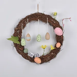 Easter twig wreath with colorful painted eggs and flowers for spring home decor and window.
