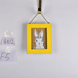 Wooden Easter bunny picture frame wall hanging with yellow border and cute rabbit sketch.