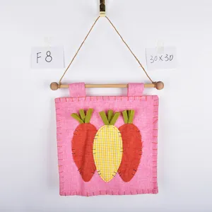 Easter carrot fabric wall hanging decoration, pink cloth with cute carrot pattern and wooden rod.