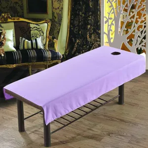 Housse de table de massage professionnelle avec trou facial, imperméable et étanche.