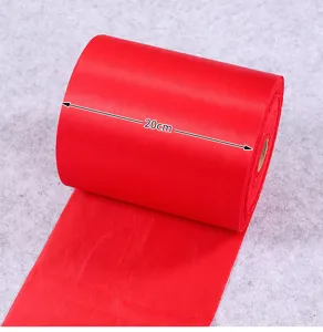 Red satin ribbon detail showing 20cm width, smooth texture for festive decoration.