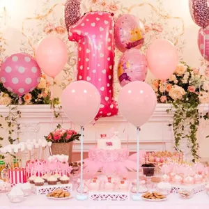 Detail view of pink party balloon stand with plum base displaying festive setup for birthday.