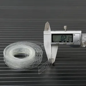 Close-up detail of transparent balloon arch chain strip showing thin plastic material and thickness.