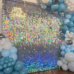 Shimmer wall backdrop with iridescent sequins and blue white balloons for party decor scene.