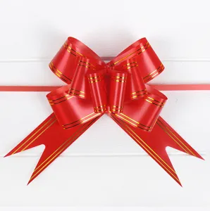 Large red pull bow with gold stripes for wedding gift wrapping and car decoration.