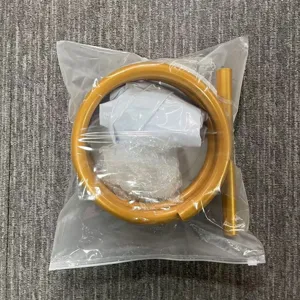 Detailed view of gold metal balloon arch kit parts packed securely in transparent bag.