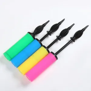 Detailed view of colorful manual plastic balloon hand pumps in green blue yellow and pink.