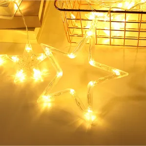 Detailed close-up of LED star string lights with warm glow for bedroom and holiday decor.