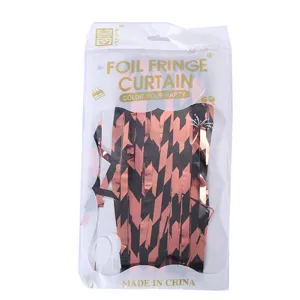 Foil fringe curtain packaging detail, matte chevron design for party and wedding background decor.