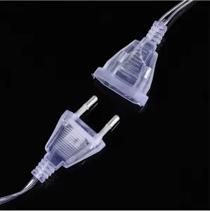 Transparent plug and socket connector for LED string lights, durable and safe design.