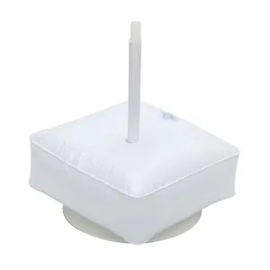 Detail shot of white square water bag base for balloon arch and party decorations, sturdy support.