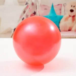 Red latex balloon detail shot, ideal for wedding party and DIY celebration decoration.