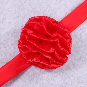 Bright red satin ribbon flower for celebration ceremony decoration and festival opening events.
