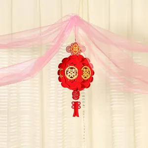 Chinese wedding hanging lantern with pink tulle decoration for romantic bridal room setup