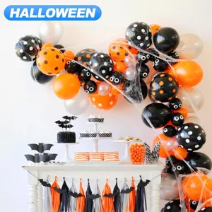 Halloween balloon arch kit with black orange polka dot balloons and spider web decor