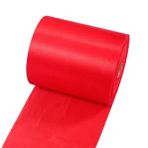 Festive red satin fabric roll for celebrations, ribbon cutting, and decorative use.