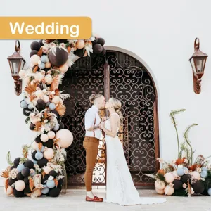 Detailed view of balloon arch kit setup in wedding outdoor scene with elegant decorative balloons.
