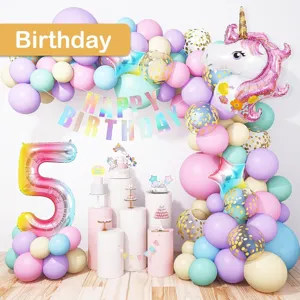 Birthday balloon arch kit with unicorn foil balloon and pastel latex balloons for party decor.