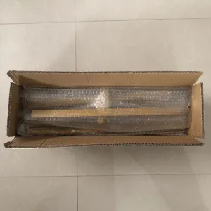 Metal balloon arch frame parts packaged securely in a cardboard box for safe shipping.