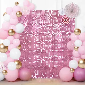 Fond de mur à paillettes scintillantes avec des ballons roses et blancs pour fête de mariage.