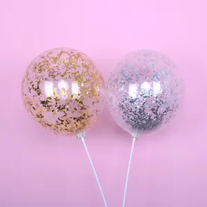 Clear confetti balloons with gold and silver sequins on sticks for party and wedding decor.