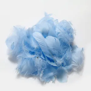 Detail shot of fluffy light blue dyed feathers, ideal for DIY bobo ball filling and crafts.