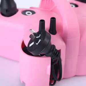 Electric balloon inflator detail view, portable pink air pump with plug and nozzles.
