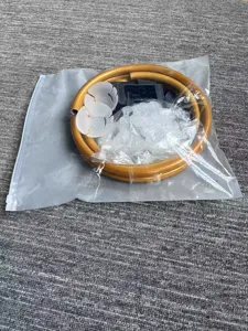 Detailed view of balloon arch kit components including flexible golden rods and clips.