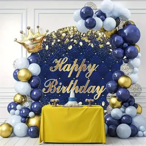 Detail view of blue and gold balloon arch kit with happy birthday backdrop for party decor.