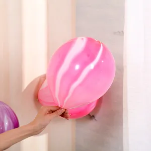 Close-up detail of a pink agate marble latex balloon for party decoration and celebration.