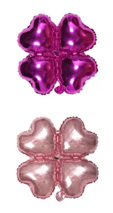 Heart shaped foil balloons arranged as a four leaf clover for party and event decoration details.