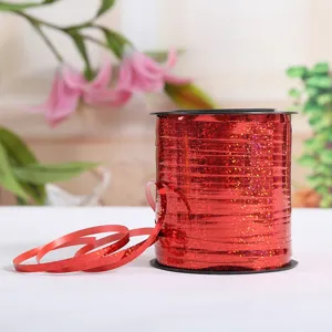 Red holographic ribbon detail, shiny glitter balloon string for wedding party decor view.