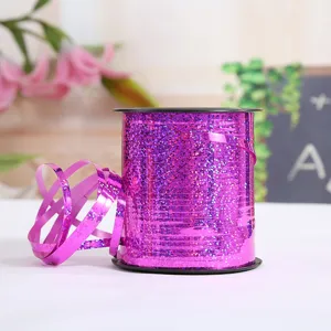 Purple laser curling ribbon roll detail, shiny holographic balloon string for party decor.
