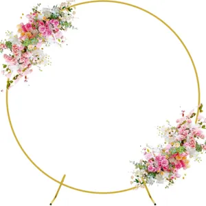 Gold round metal wedding arch stand with pink and white artificial floral decor for parties.