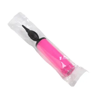 Portable plastic hand balloon pump detail view, pink and black design in clear package.