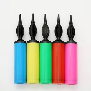 Detailed shot of multicolored plastic balloon hand pumps, showing various bright colors.