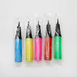 Detail view of portable plastic hand balloon pumps in multiple bright colors neatly packaged.