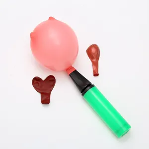 Portable handheld balloon pump with novelty pink balloons set for parties and celebrations.