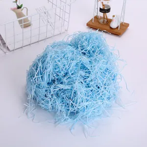 Shredded paper raffia gift box filler light blue color 100g for chocolate and candy packaging.
