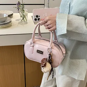 Stylish pink bowling handbag for women, vintage solid color PU leather tote with cute charm.