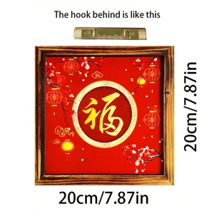 Detail view of the square wooden New Year decorative frame showing the blessing character and hook.