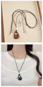 Detailed view of Korean vintage wooden teardrop pendant long necklace, exquisite retro design.